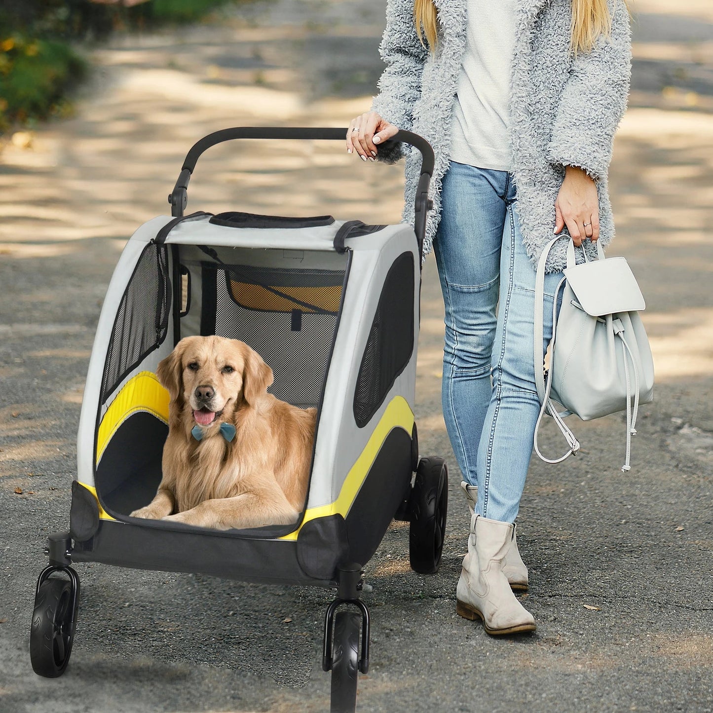Dog riding in open Portable, Foldable Dog 4 Wheel Stroller for Large Dogs for Outside Transportation - The Squeaky Toy
